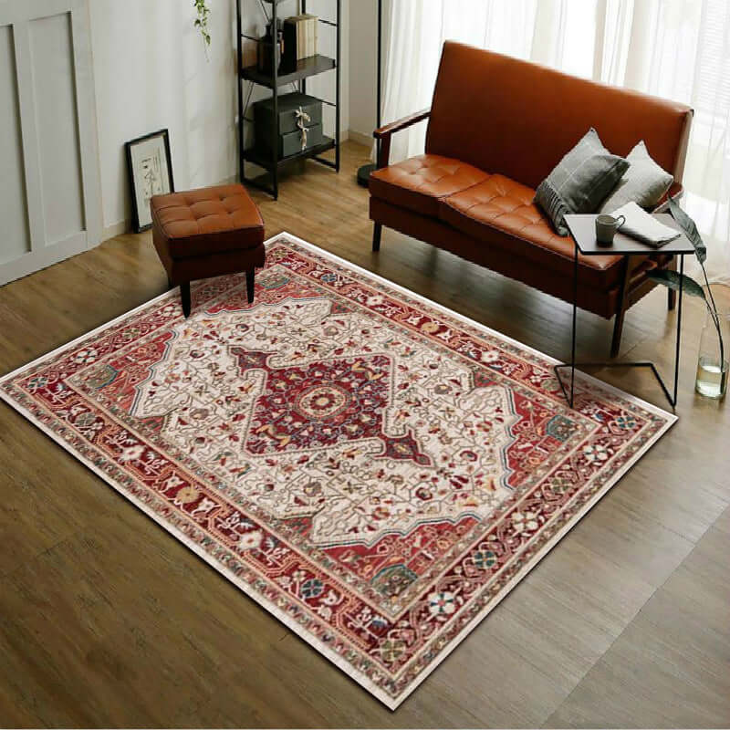 Elegant red patterned living room rug adding warmth to a cozy space with modern decor and natural light.