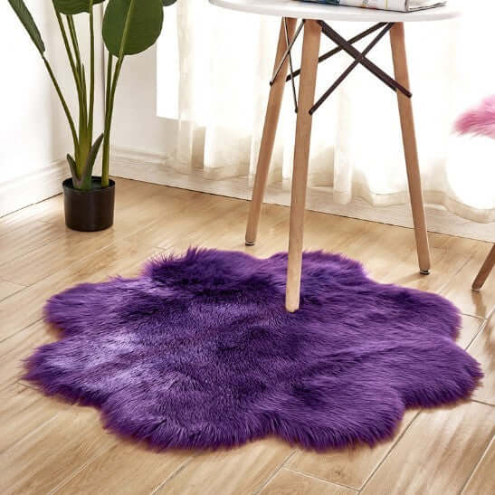 Plush purple artificial woolen carpet rug under a table, adding warmth and style to the room.