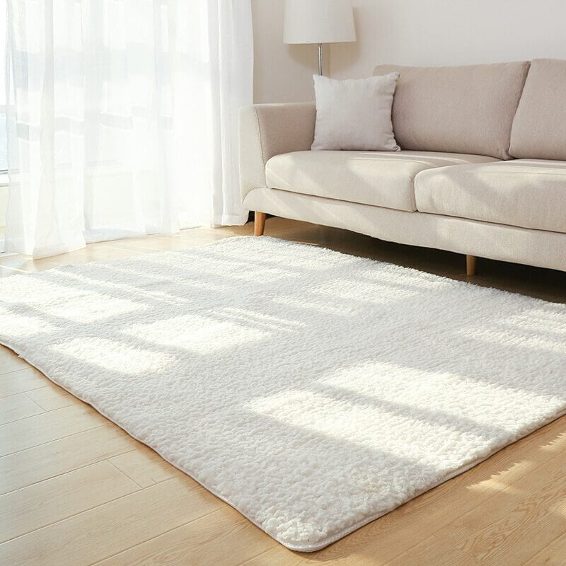 European and American style solid carpet rug in a cozy living room next to a sofa, ideal for home decoration.