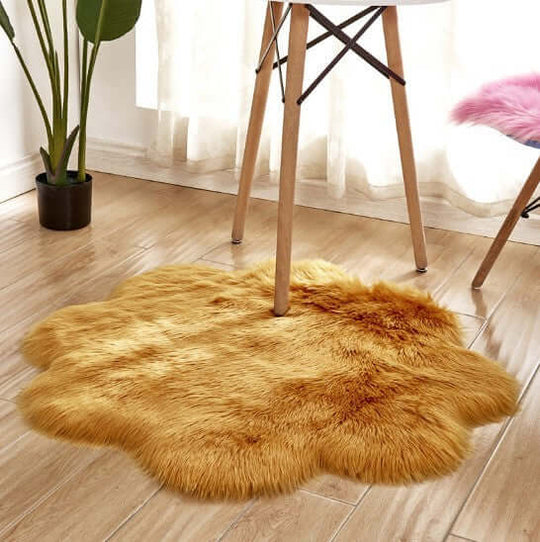 Plush artificial woolen carpet rug in a golden color, placed under a chair in a stylish living space.